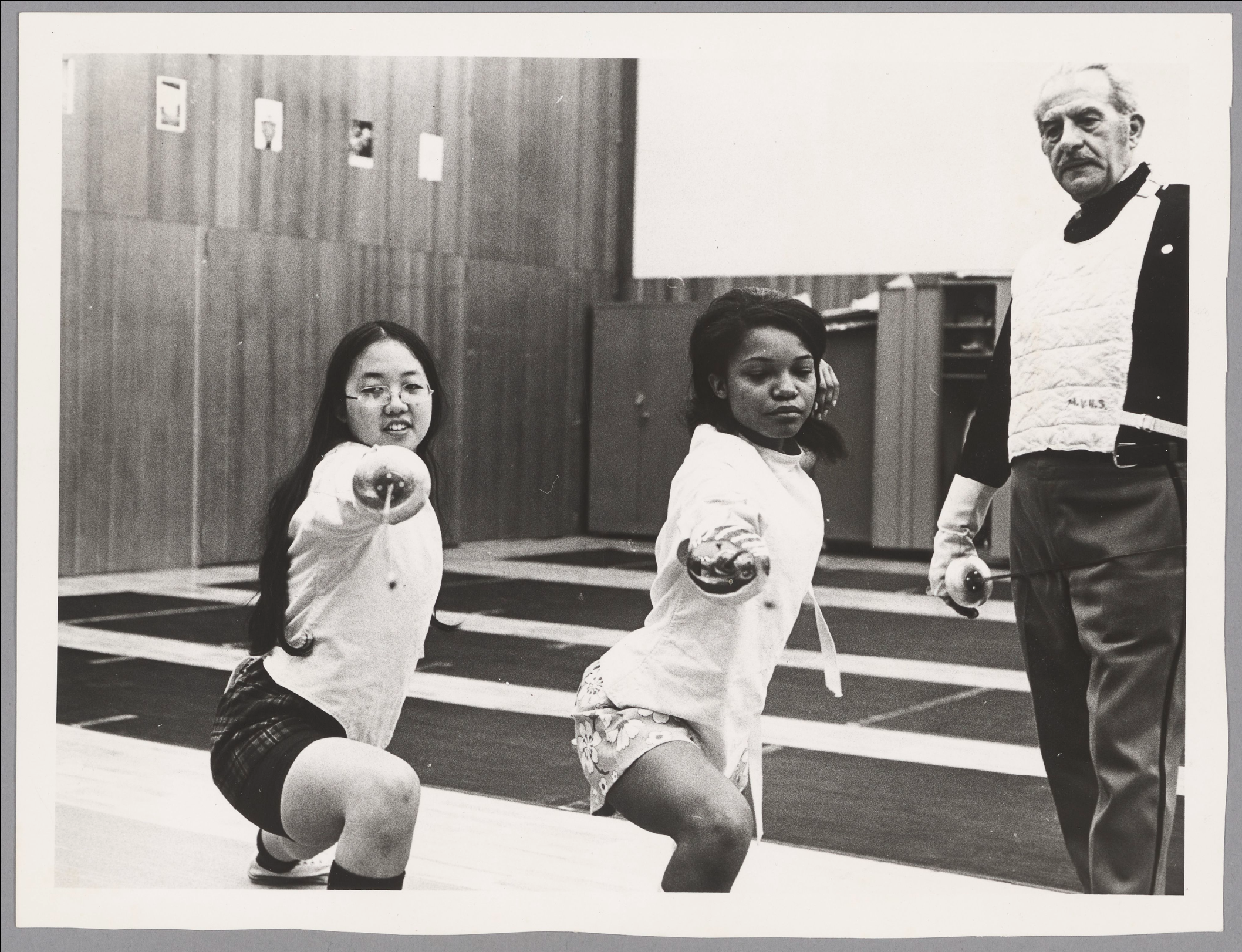 Silvio Napoleon Vitale instructs two student fencers, ca. 1971